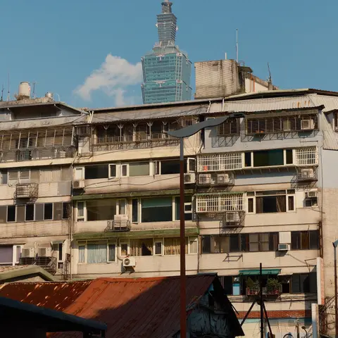 Taipei 101 rising behind an old apartment block — Taipei