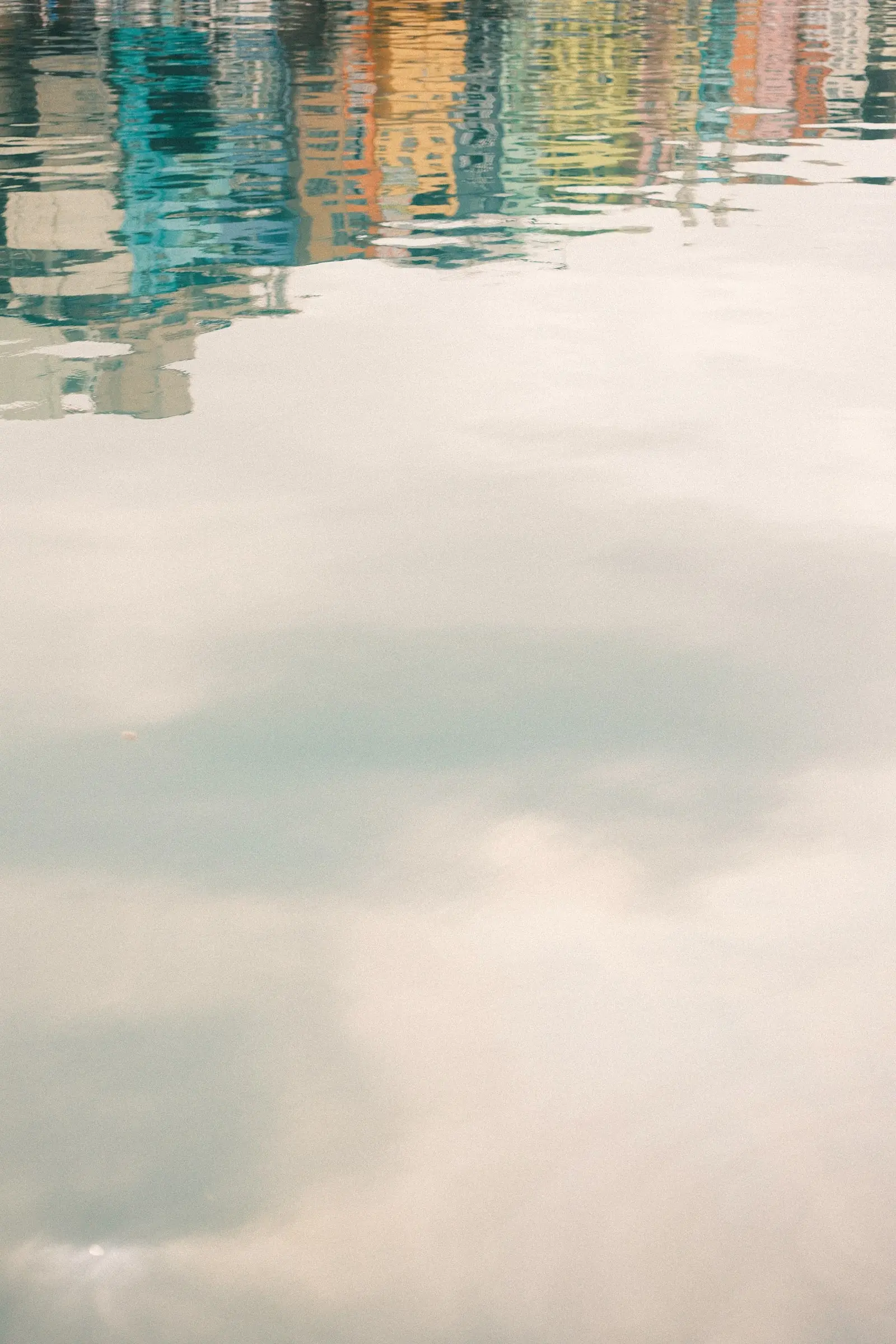 Colorful harbor houses reflected in still water — Zhengbin Fishing Harbor, Keelung
