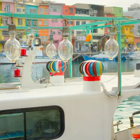 Lamps on a fishing boat in front of colorful houses — Zhengbin Fishing Harbor, Keelung