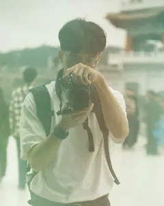 Brandon taking a photo with a Fujifilm camera